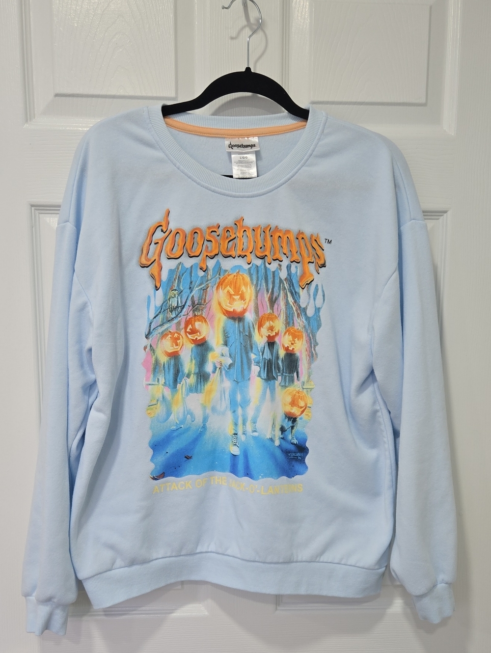 Goosebumps Light Blue Crewneck Sweatshirt with Pumpkin Graphic